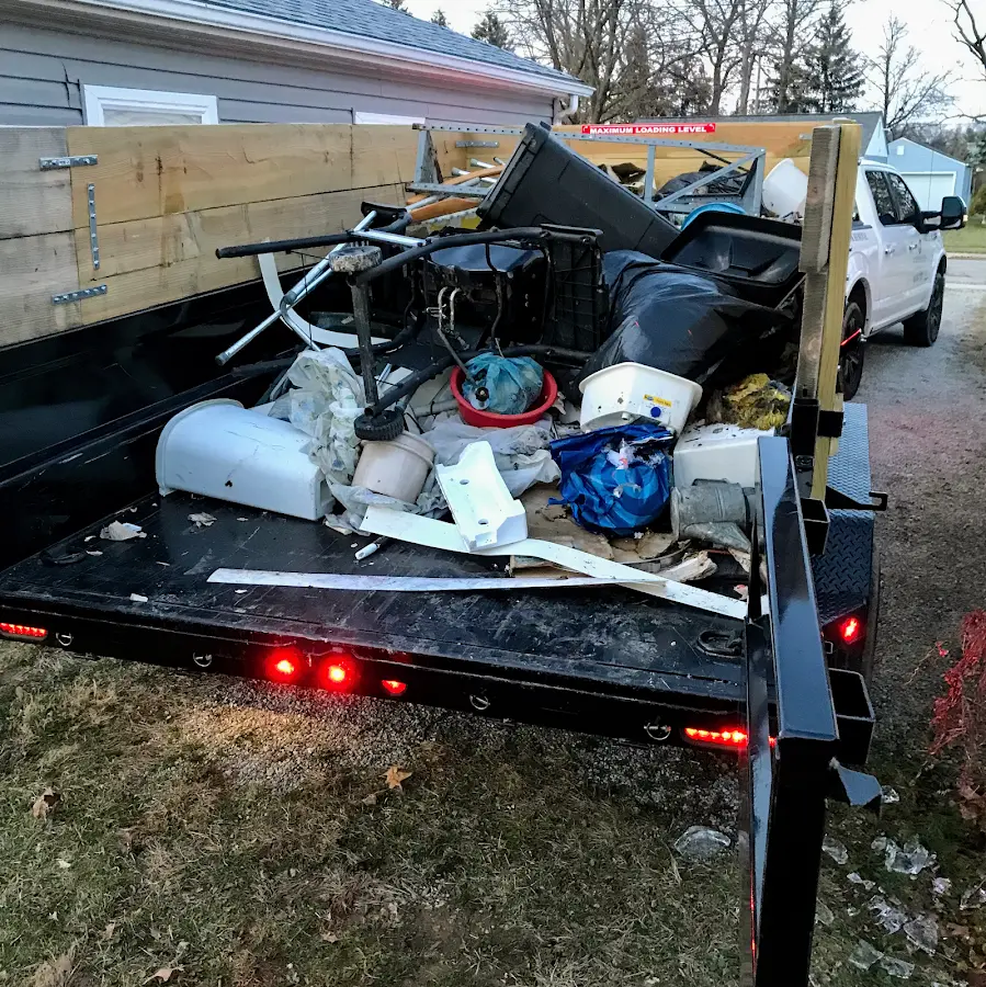 Roll-off dumpster delivered to a residential driveway in Roanoke Rapids